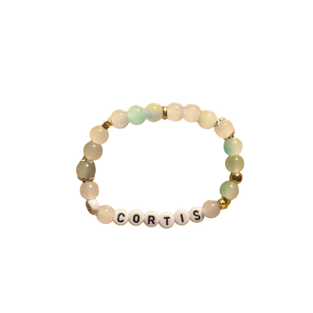 Cortis name bracelet on white background