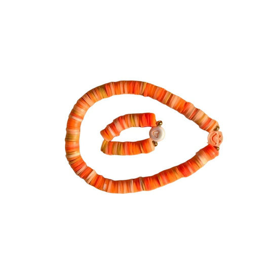 Pumpkin bracelet duo on white background